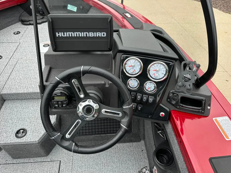 Slide: The Image of 2024 Tracker Targa V-19 WT boat dashboard with Humminbird electronics and steering wheel. - 4
