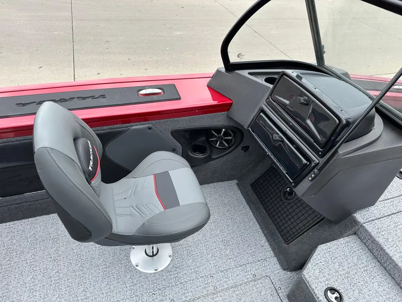 Slide: The Image of 2024 Tracker Targa V-19 WT boat interior with captain's chair and dashboard. - 5