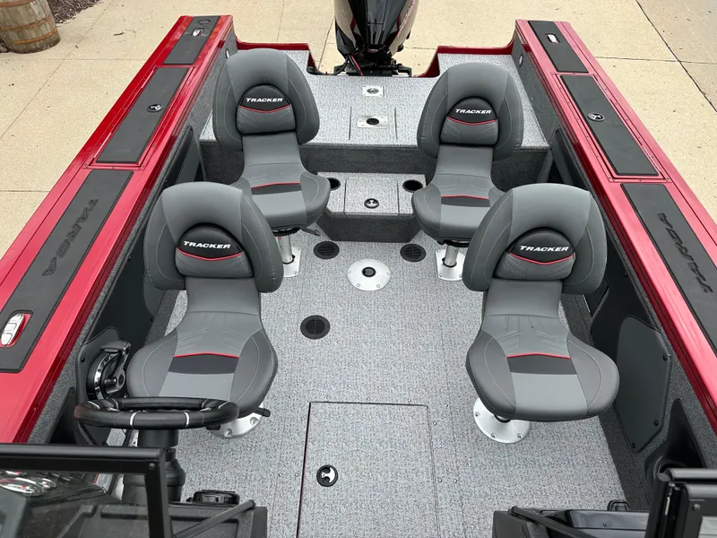 Slide: The Image of 2024 Tracker Targa V-19 WT boat interior with four seats and gray flooring. - 6