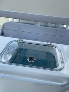 Slide: The Image of 2023 Mako 214 CC boat livewell with clear lid. - 17