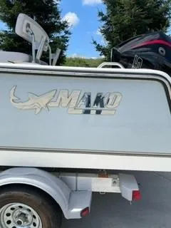 Slide: The Image of 2023 Mako 214 CC boat on trailer, side view. - 4