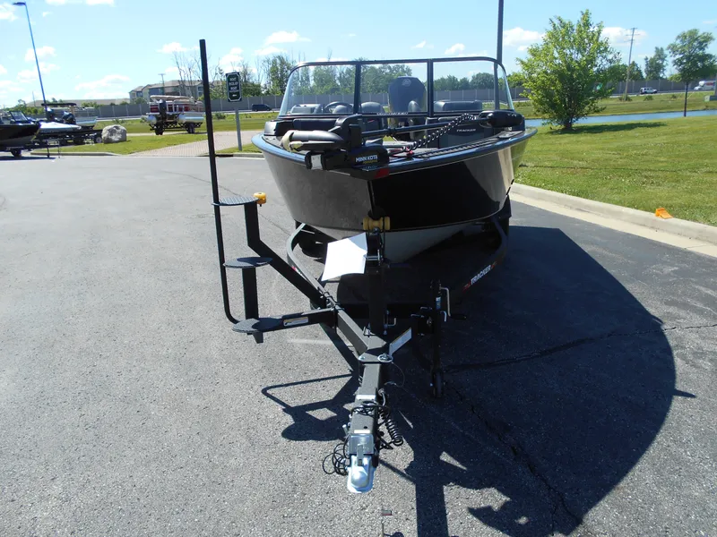 Slide: The Image of 2024 Tracker Targa V-19 WT boat on a trailer in a parking lot. - 3