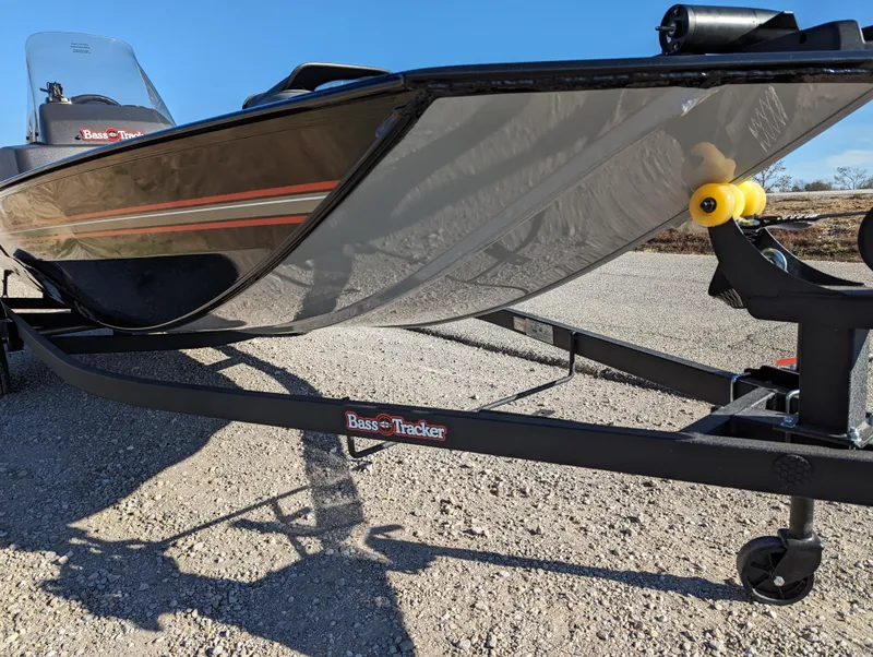 Slide: The Image of 2024 Tracker Bass Tracker Classic XL boat on a trailer, close-up view. - 11