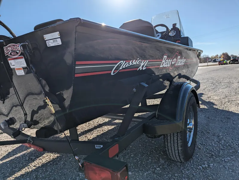 Slide: The Image of 2024 Tracker Bass Tracker Classic XL boat on a trailer, side view. - 6