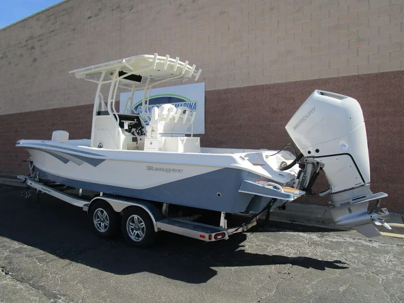 Slide: The Image of 2024 Ranger 2660 Bay boat on trailer, featuring sleek design and powerful outboard motor. - 1