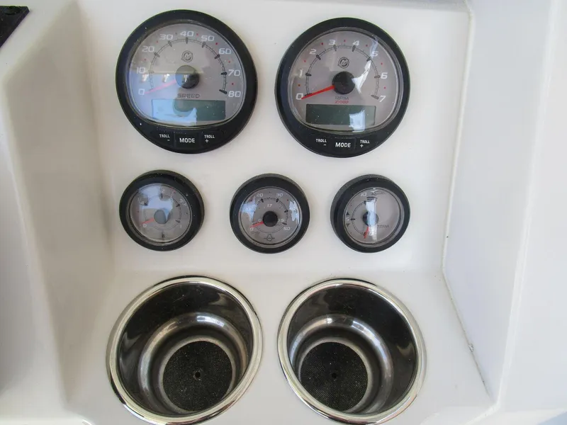 Slide: The Image of Dashboard of 2024 Ranger 2660 Bay boat with gauges and cup holders. - 11