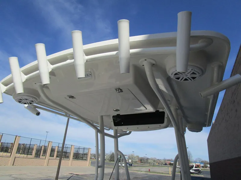 Slide: The Image of 2024 Ranger 2660 Bay boat T-top with rod holders and speakers. - 12