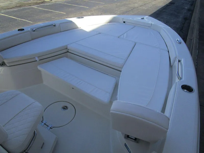 Slide: The Image of 2024 Ranger 2660 Bay boat with spacious white seating area. - 13