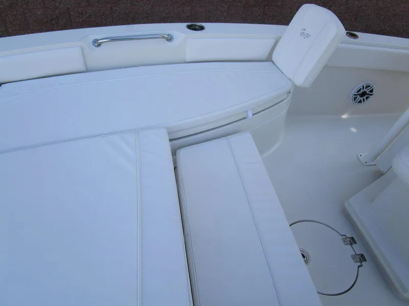 Slide: The Image of 2024 Ranger 2660 Bay boat interior with white cushioned seating. - 15