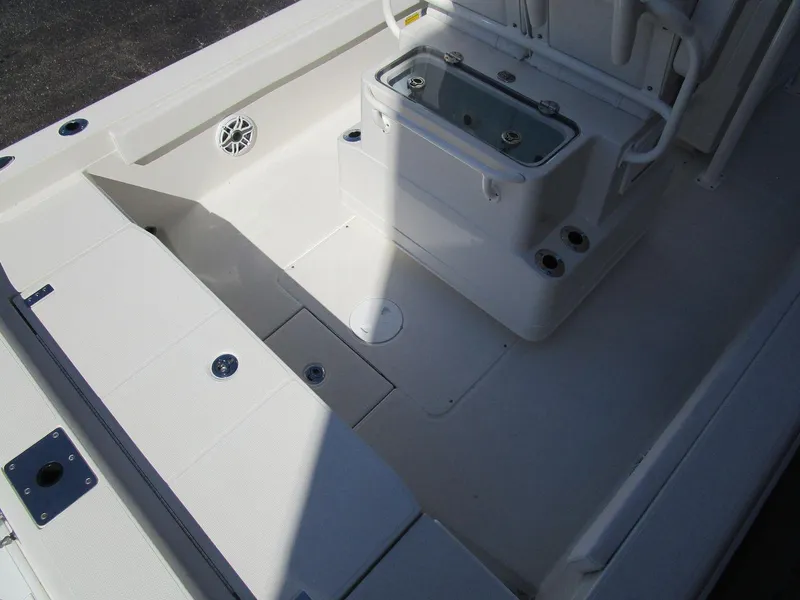 Slide: The Image of 2024 Ranger 2660 Bay boat interior with storage compartments and seating. - 6
