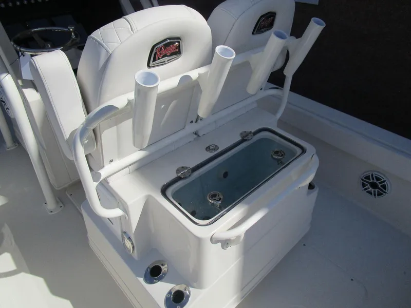 Slide: The Image of 2024 Ranger 2660 Bay boat seating with rod holders and storage compartment. - 8