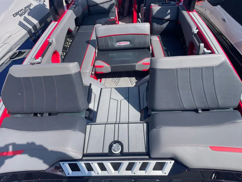Slide: The Image of 2021 Supra SE boat interior with gray and red seating. - 11