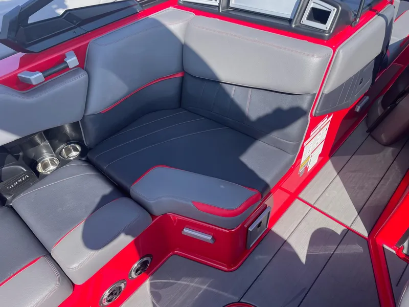 Slide: The Image of Red and gray interior seating of a 2021 Supra SE boat. - 15