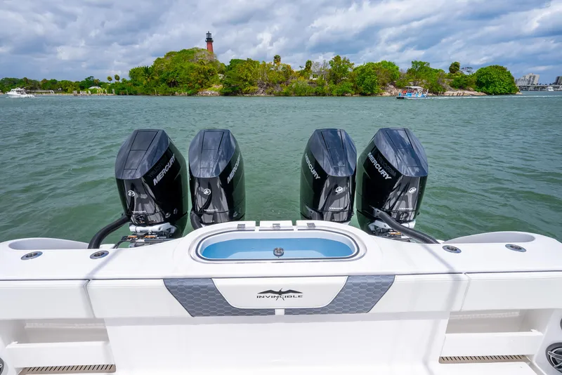 Slide: The Image of 2023 Invincible 37 Catamaran with four Mercury outboard engines on the water. - 18