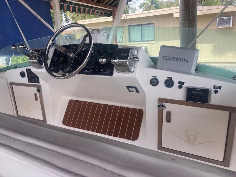 Slide: The Image of 1987 Bertram 28 Sport Fisherman boat helm with Garmin navigation system. - 13