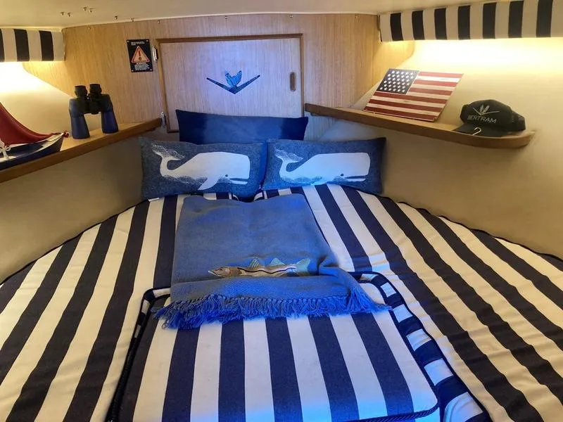 Slide: The Image of Cozy cabin interior of a 1987 Bertram 28 Sport Fisherman with nautical decor. - 3