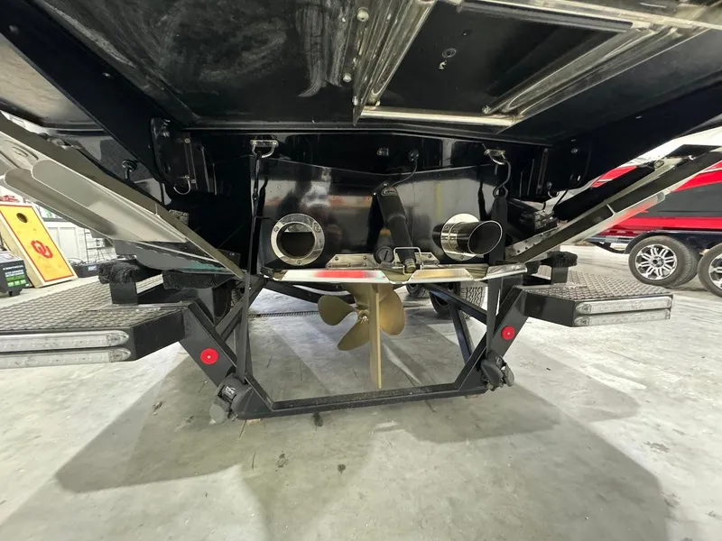 Slide: The Image of 2019 MasterCraft XStar boat stern view showing propeller and exhaust system. - 11