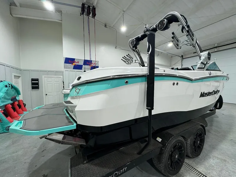 Slide: The Image of 2019 MasterCraft XStar boat on trailer in indoor storage facility. - 12