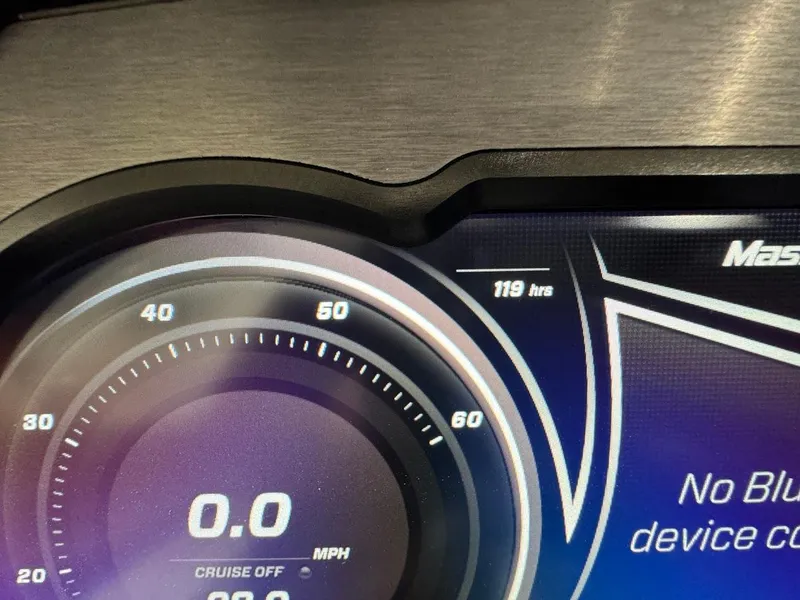 Slide: The Image of Close-up of 2019 MasterCraft XStar dashboard showing 119 hours and 0.0 MPH. - 21