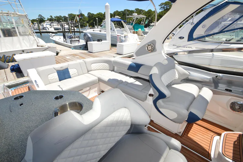 Slide: The Image of Luxurious 2013 Chaparral 327 SSX boat interior with plush seating and sleek design. - 12