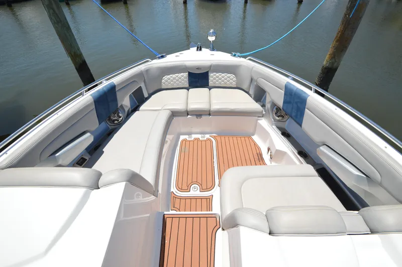 Slide: The Image of 2013 Chaparral 327 SSX boat interior with spacious seating and teak flooring. - 16