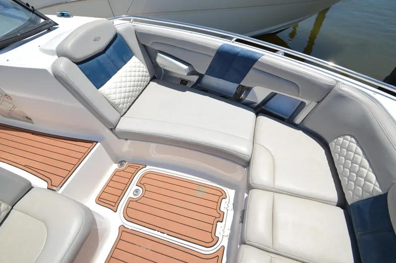 Slide: The Image of Luxurious seating area on a 2013 Chaparral 327 SSX boat with elegant upholstery. - 17