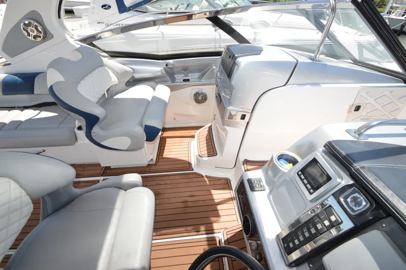 Slide: The Image of Interior of 2013 Chaparral 327 SSX boat with luxurious seating and modern dashboard. - 23