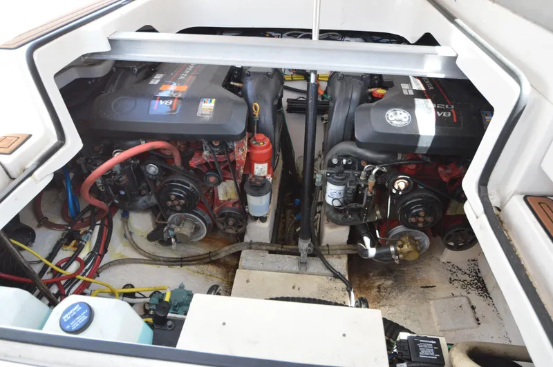 Slide: The Image of Engine compartment of a 2013 Chaparral 327 SSX boat, featuring dual V8 engines. - 35