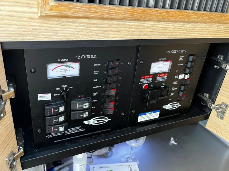 Slide: The Image of Electrical control panel on a 2013 Chaparral 327 SSX boat. - 38