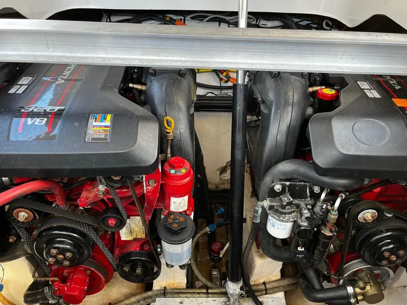 Slide: The Image of Engine compartment of a 2013 Chaparral 327 SSX boat, featuring dual V8 engines. - 39