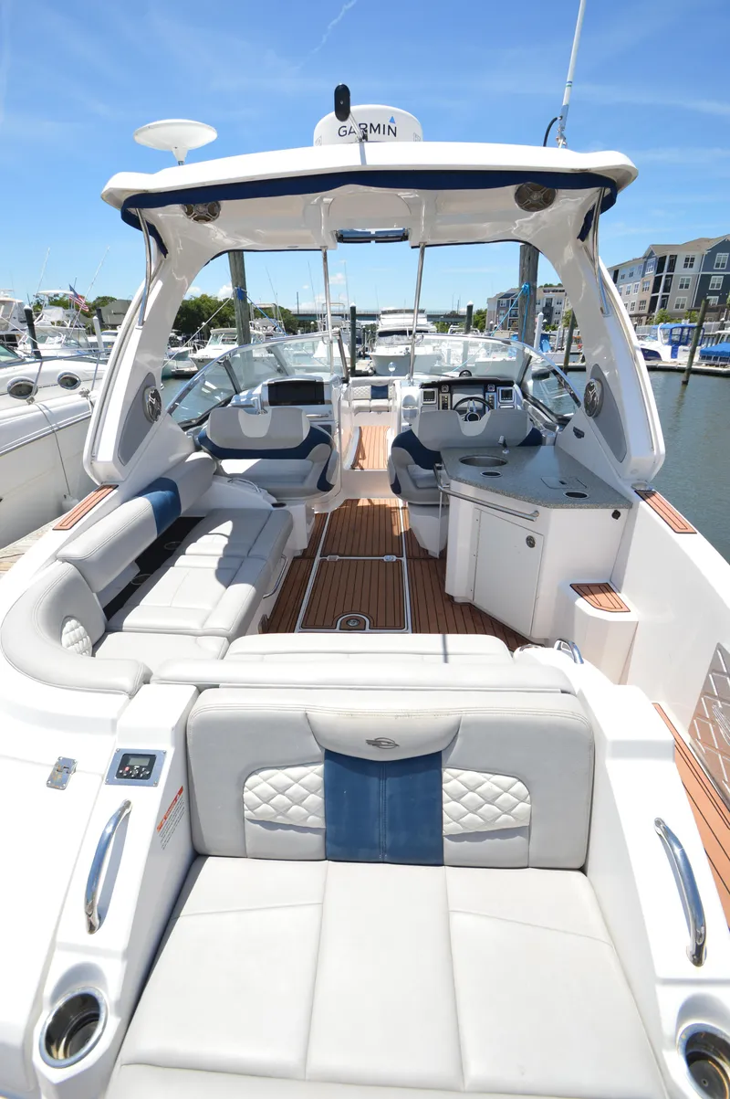Slide: The Image of 2013 Chaparral 327 SSX boat interior with luxurious seating and modern amenities. - 6