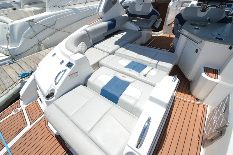 Slide: The Image of 2013 Chaparral 327 SSX boat interior with luxurious seating and sleek design. - 8