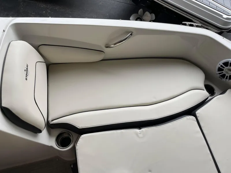 Slide: The Image of 2024 Stingray 191 DC boat interior with white cushioned seating. - 11