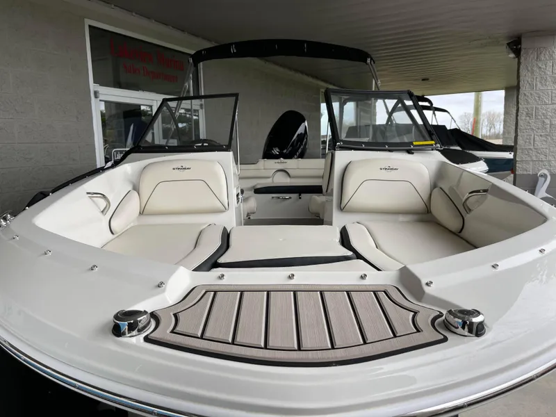 Slide: The Image of 2024 Stingray 191 DC boat with spacious seating and modern design. - 2
