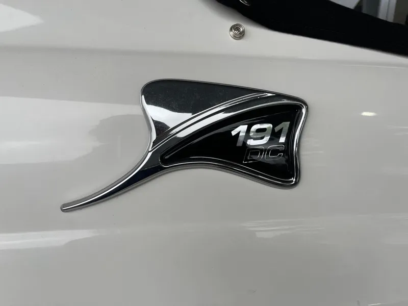 Slide: The Image of 2024 Stingray 191 DC logo on white boat exterior. - 22