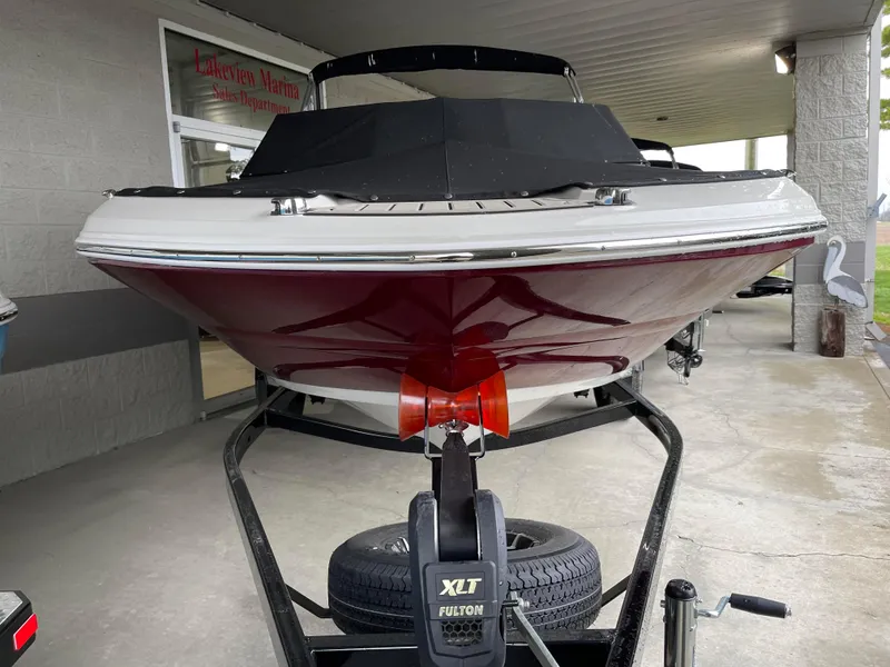 Slide: The Image of 2024 Stingray 191 DC boat on trailer at dealership. - 24
