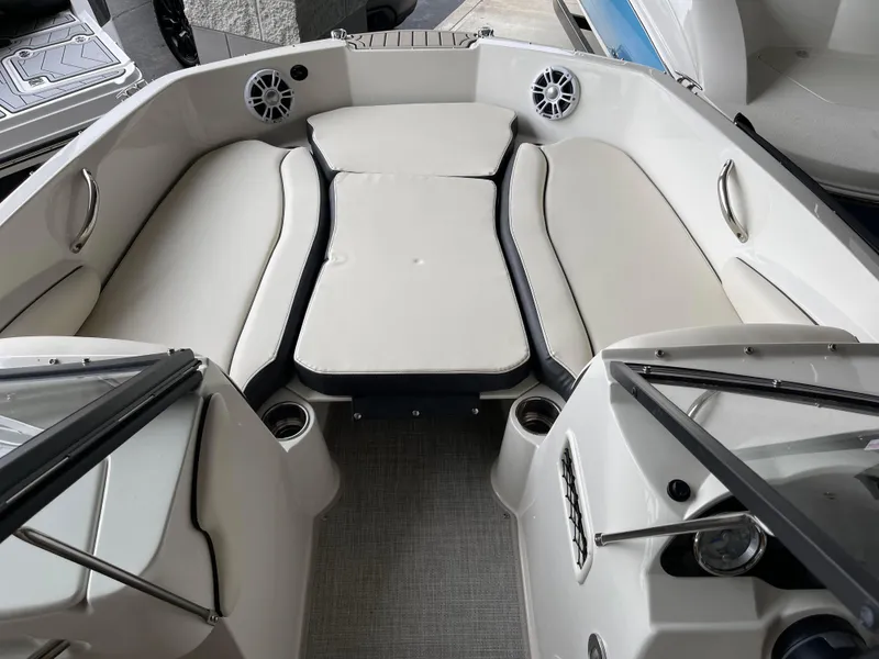 Slide: The Image of 2024 Stingray 191 DC boat interior with cushioned seating and cup holders. - 5