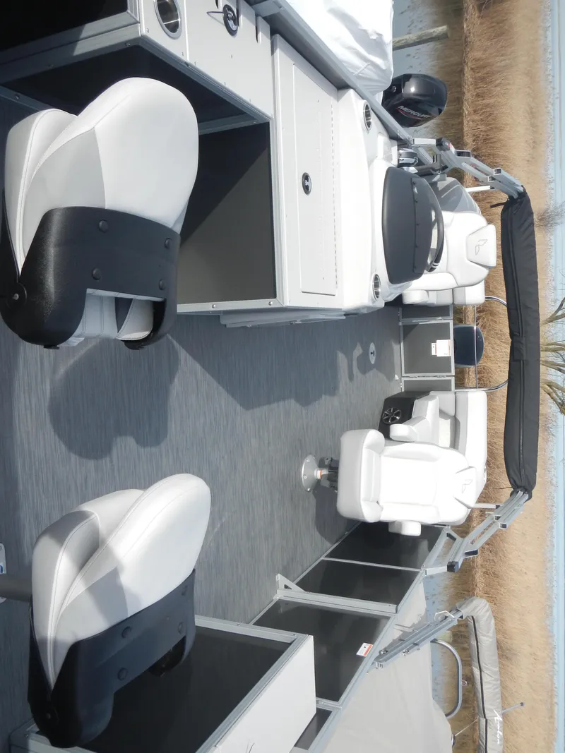 Slide: The Image of 2024 Lowe SF 212 WT pontoon boat interior with white and black seating. - 10