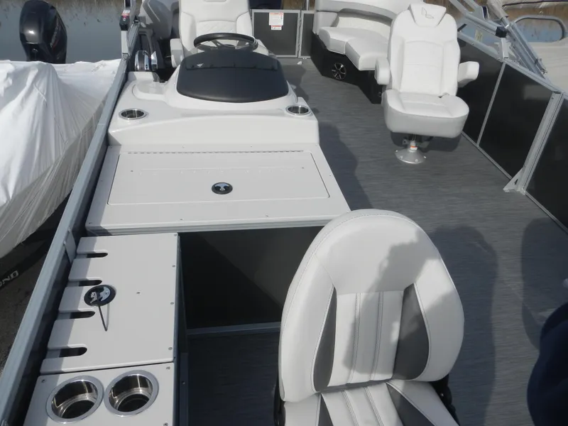 Slide: The Image of 2024 Lowe SF 212 WT pontoon boat interior with seating and console. - 11
