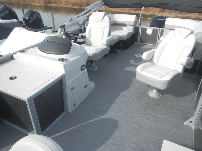 Slide: The Image of 2024 Lowe SF 212 WT pontoon boat interior with white seating and helm station. - 12