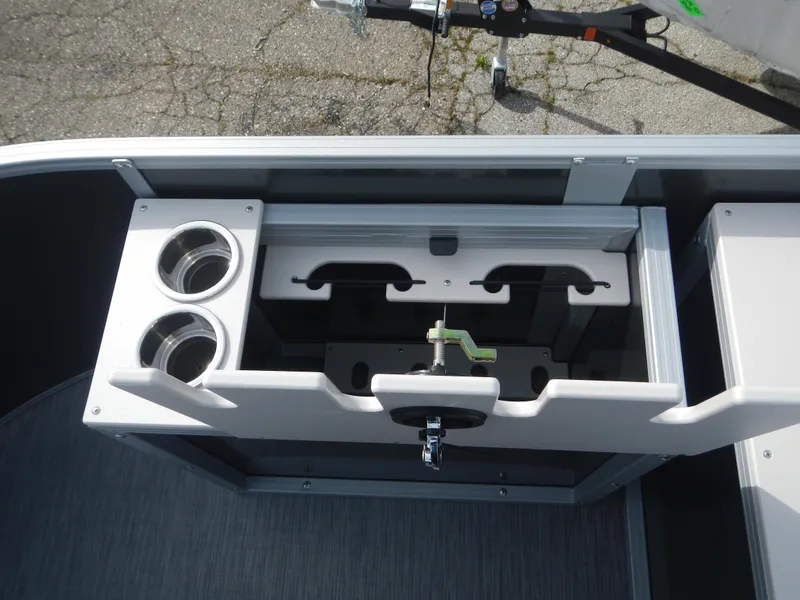 Slide: The Image of 2024 Lowe SF 212 WT boat interior with cup holders and storage compartments. - 13
