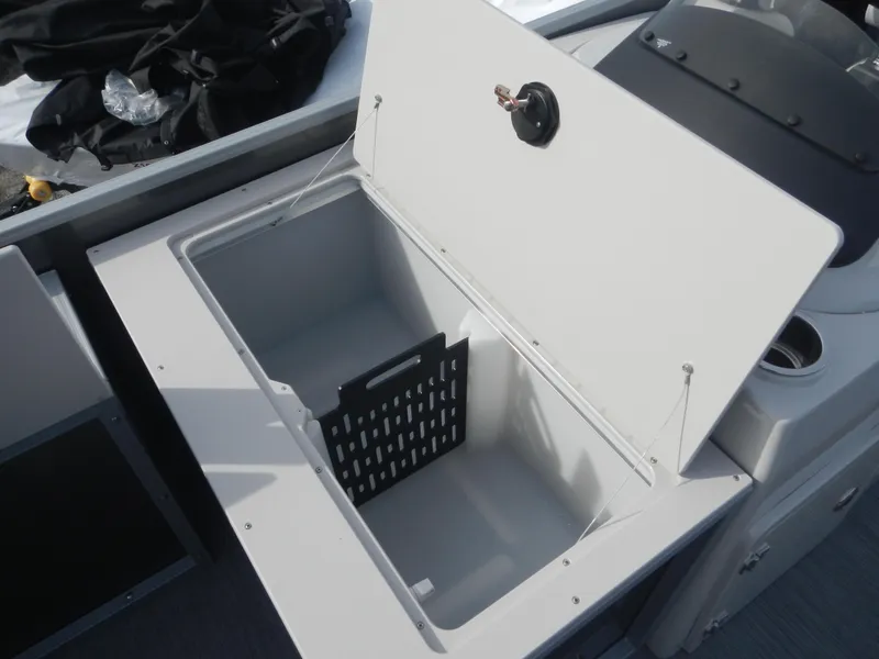 Slide: The Image of 2024 Lowe SF 212 WT storage compartment with open lid. - 14