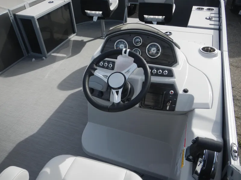 Slide: The Image of 2024 Lowe SF 212 WT boat dashboard with steering wheel and control panel. - 15