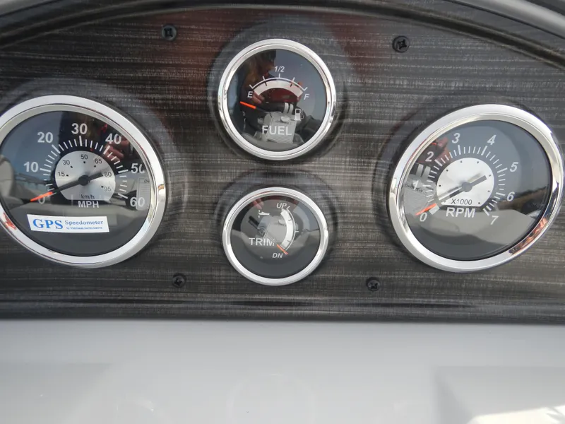 Slide: The Image of Dashboard of 2024 Lowe SF 212 WT boat with speedometer, fuel gauge, trim gauge, and RPM gauge. - 16