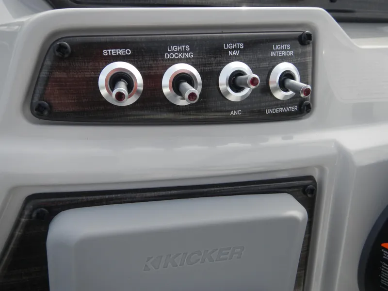 Slide: The Image of Control panel of 2024 Lowe SF 212 WT boat with stereo and light switches. - 17