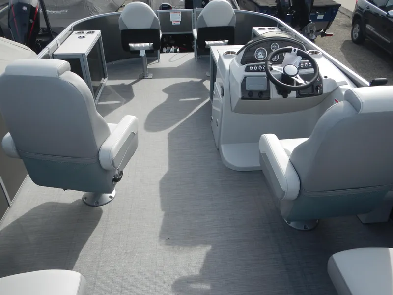 Slide: The Image of 2024 Lowe SF 212 WT boat interior with seating and steering console. - 24