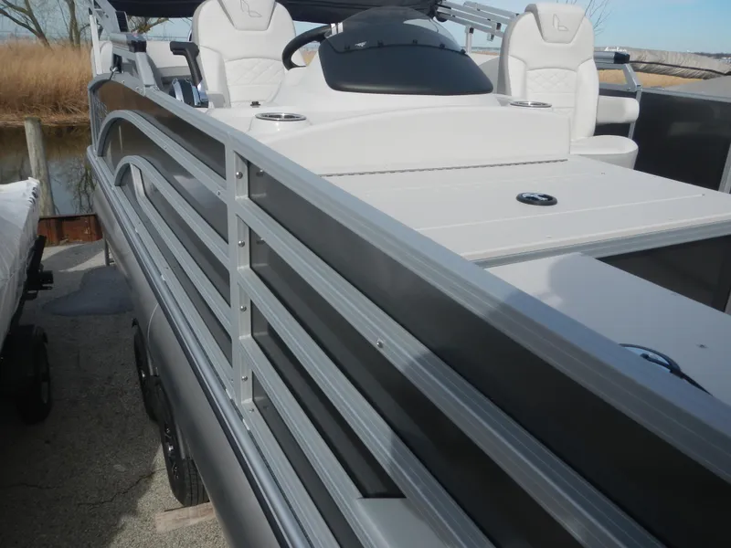 Slide: The Image of 2024 Lowe SF 212 WT pontoon boat with sleek design and comfortable seating. - 28