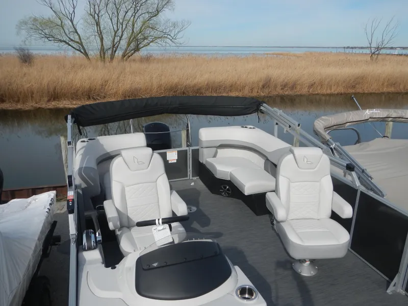 Slide: The Image of 2024 Lowe SF 212 WT pontoon boat with spacious seating and modern design. - 29