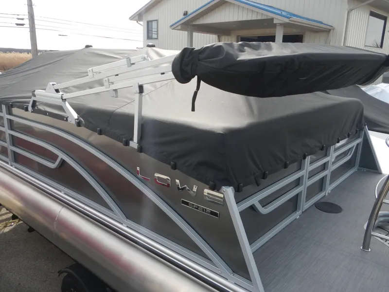 Slide: The Image of 2024 Lowe SF 212 WT pontoon boat with covered seating area. - 34