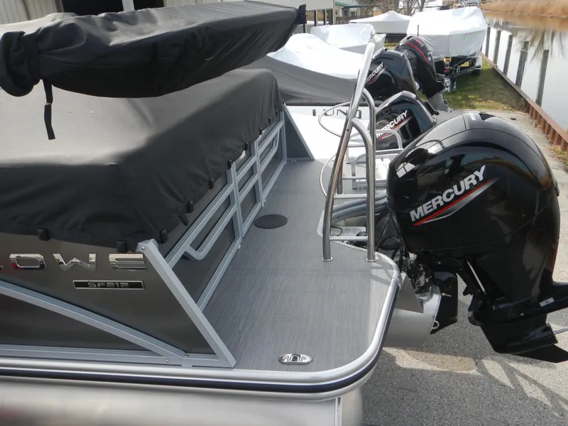 Slide: The Image of 2024 Lowe SF 212 WT pontoon boat with Mercury outboard motor. - 35